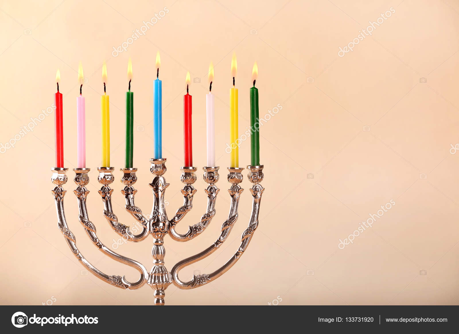 Menorah with colorful candles Stock Photo by ©belchonock 133731920