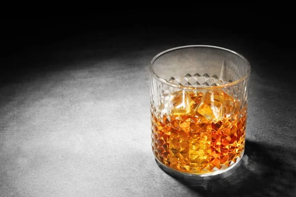 Glass of whisky with ice — Stock Photo, Image