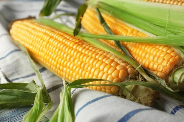 Fresh corncobs on napkin — Stock Photo, Image