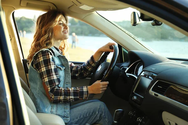 female driver in car