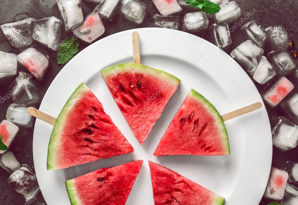 Watermelon slices on sticks