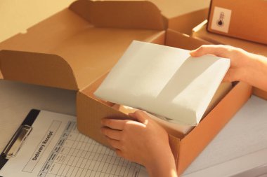 Courier hands packaging parcel clipart