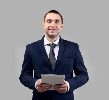 Handsome man with tablet computer clipart