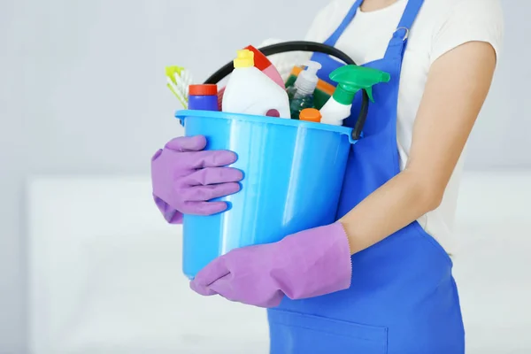 Woman with cleaning supplies — Stock Photo, Image