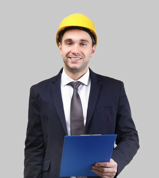 Man with clipboard and hardhat — Stock Photo, Image