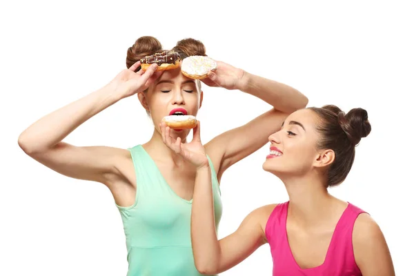 Women with tasty donuts — Stock Photo, Image