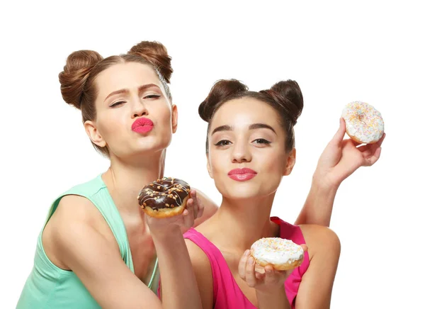 Women with tasty donuts — Stockfoto