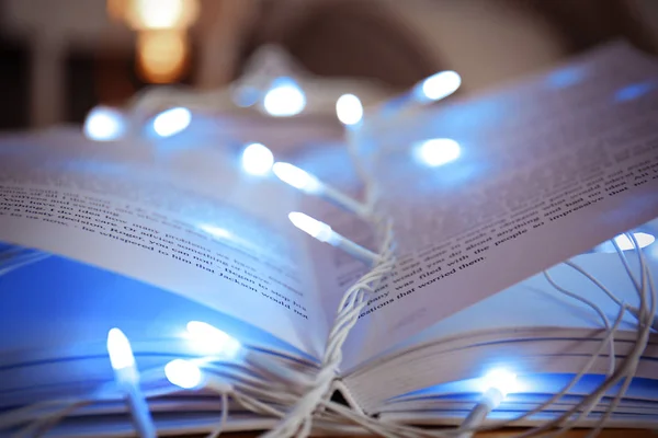 Book and beautiful garland — Stock Photo, Image