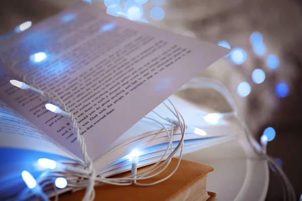 Book and beautiful garland — Stock Photo, Image