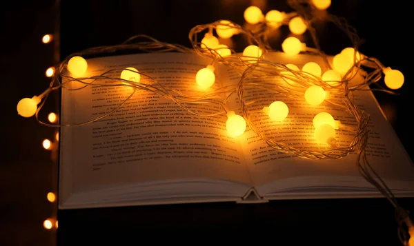 Book and beautiful garland — Stock Photo, Image