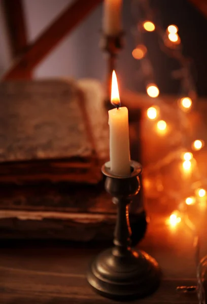 Burning candle and book — Stock Photo, Image
