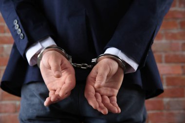 Male hands in handcuffs clipart