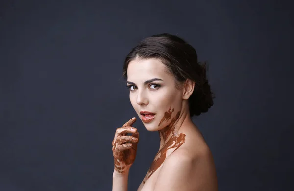 Beautiful girl covered with chocolate — Stock Photo, Image