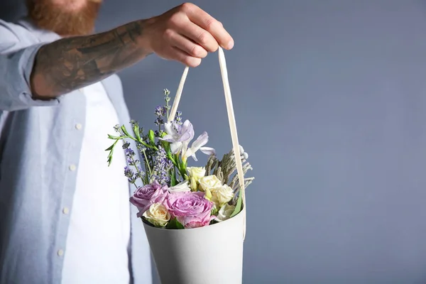 Man holding beautiful bouquet — Stock Photo, Image