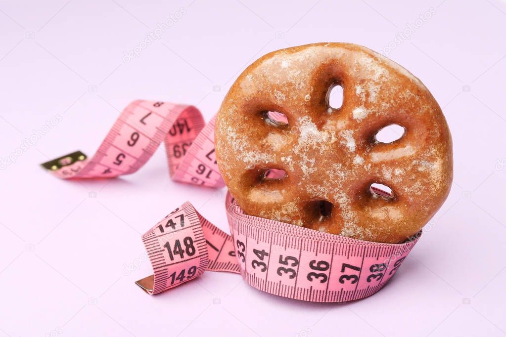 Delicious cookie and measuring tape