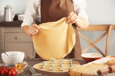 Woman making ravioli clipart