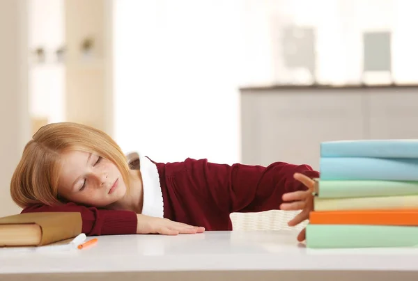 Schoolgirl tired of doing lessons — Stock Photo, Image