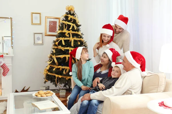 Family in living room decorated for Christmas