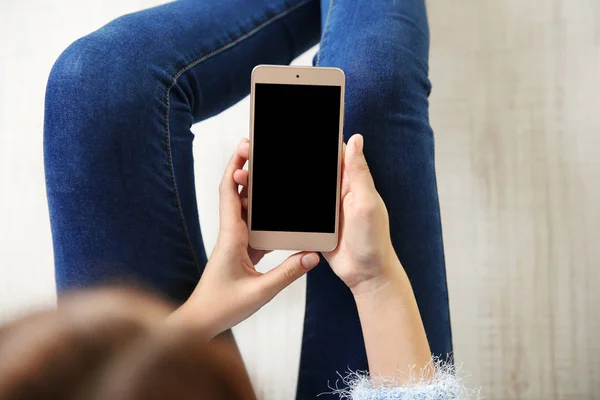 Woman holding modern cellphone — Stock Photo, Image