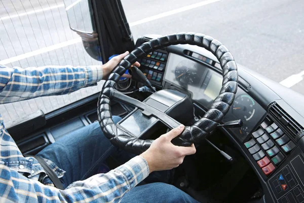 Hands of driver on steering wheel — Stock Photo, Image
