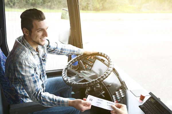 Bus driver taking ticket — Stock Photo, Image