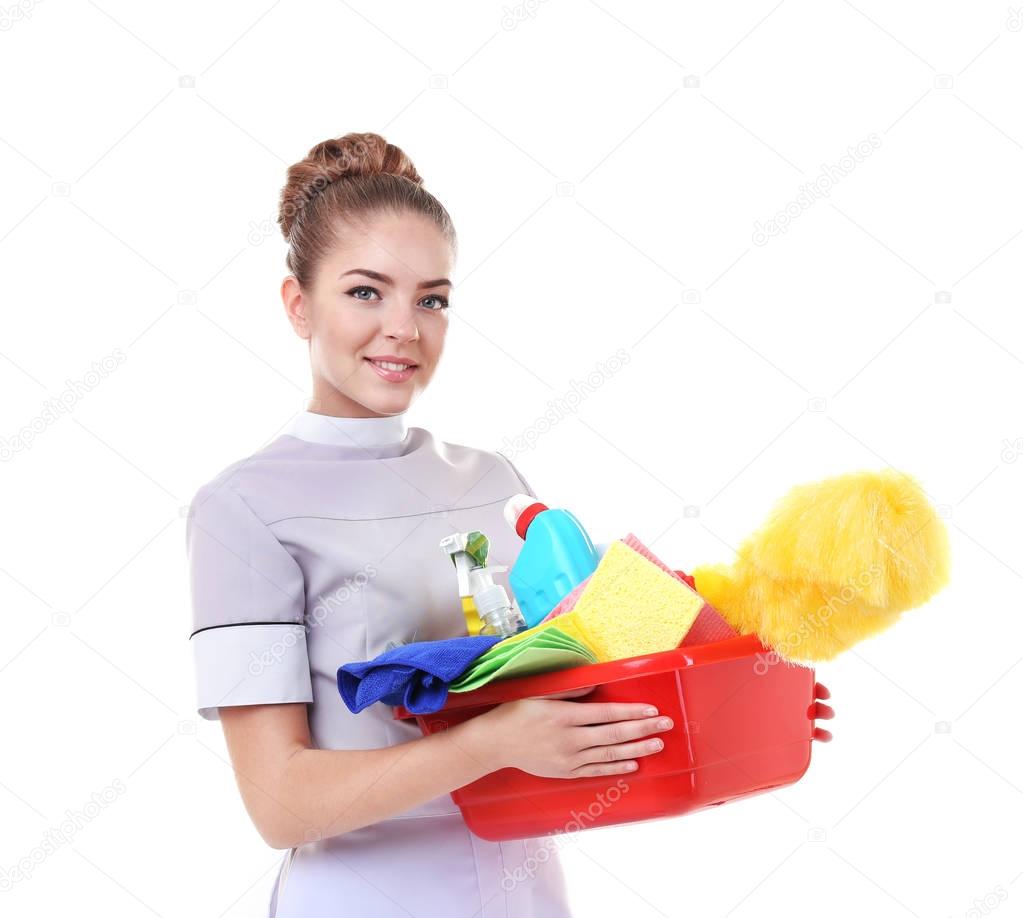 Beautiful chambermaid with cleaning equipment 