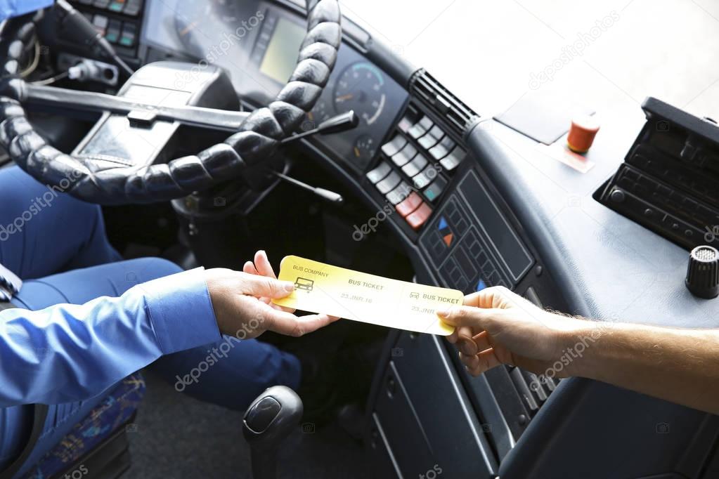 Bus driver taking ticket