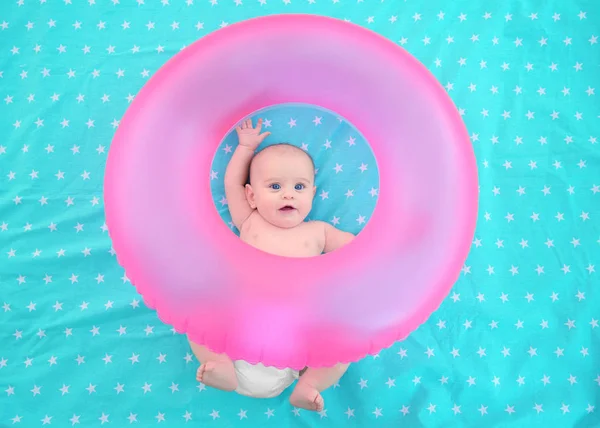 Cute baby with pink swim ring — Stock Photo, Image