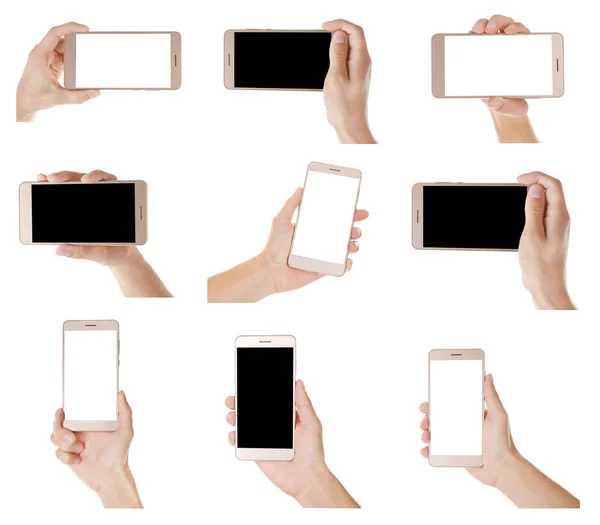Руки с современными смартфонами — стоковое фото