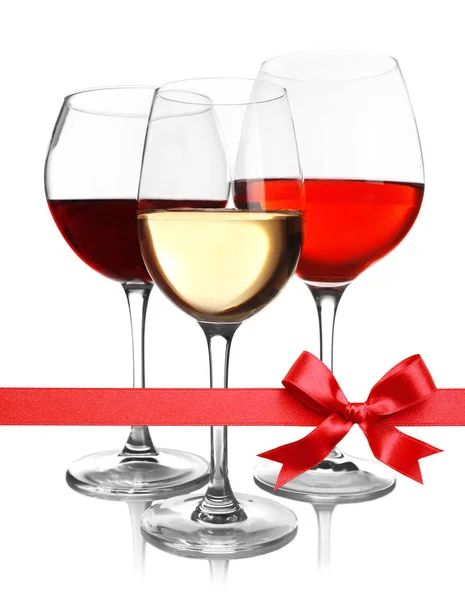 Glasses of wine with festive ribbon — Stock Photo, Image
