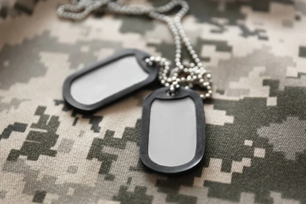 Army tokens on uniform background — Stock Photo, Image