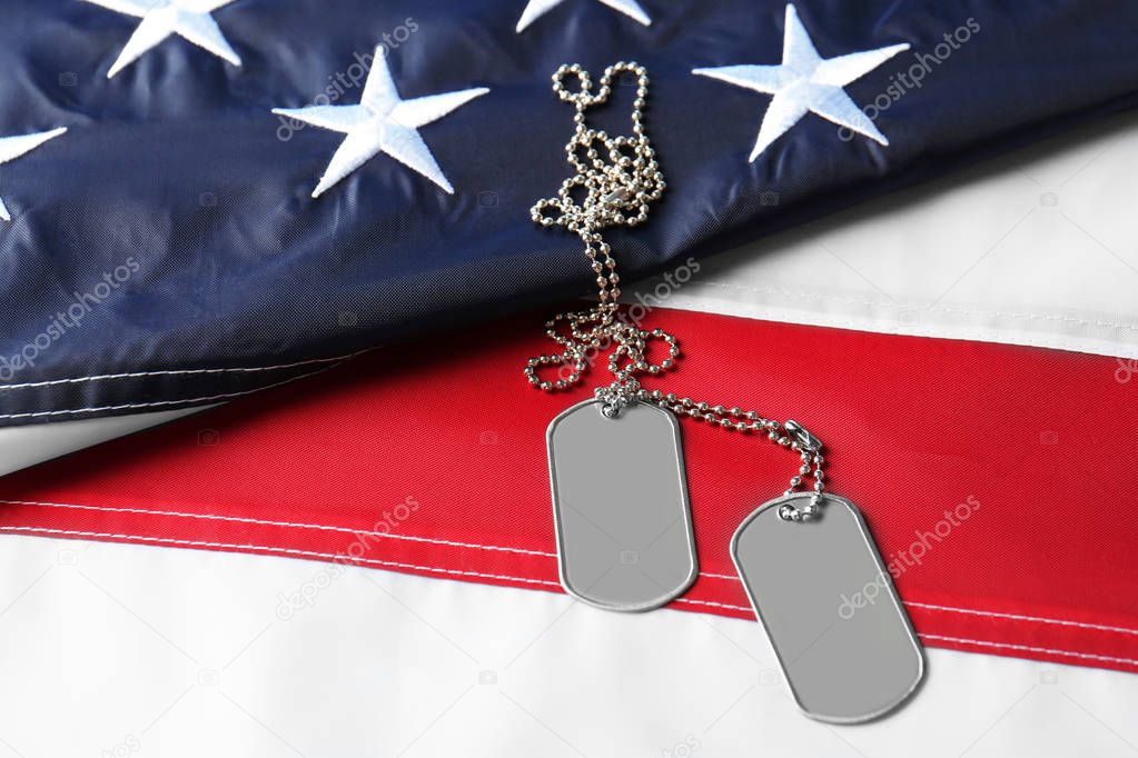 Army tokens on American national flag 