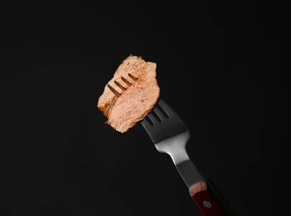 Fork with piece of tasty steak — Stock Photo, Image