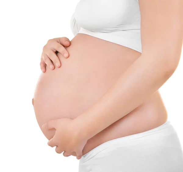 Беременная женщина на белом фоне Стоковое Изображение