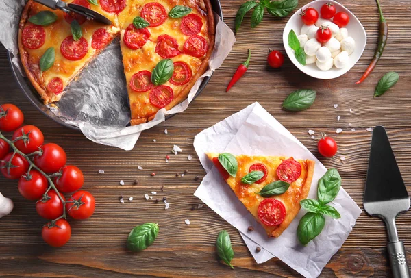 Delicious pizza on table — Stock Photo, Image