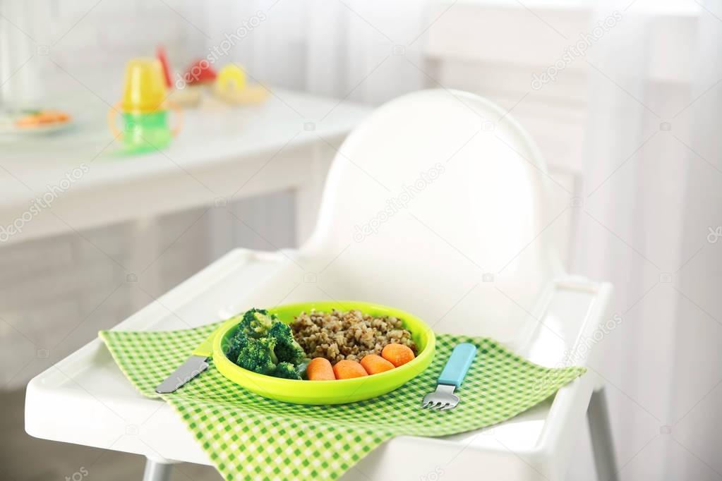Highchair with healthy baby food
