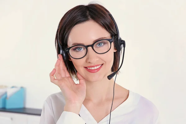 Young beautiful technical support dispatcher working, closeup