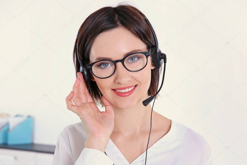 Young beautiful technical support dispatcher working, closeup
