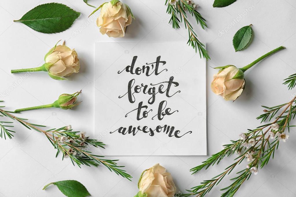 Quote written on paper with flowers