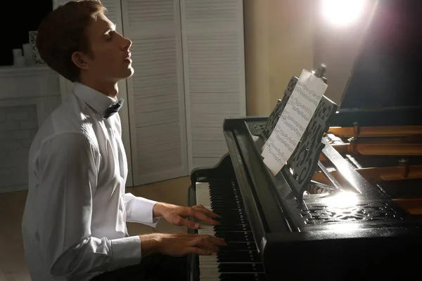 Young man playing piano