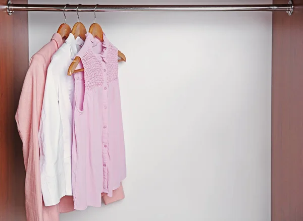 Hangers with female shirts — Stock Photo, Image