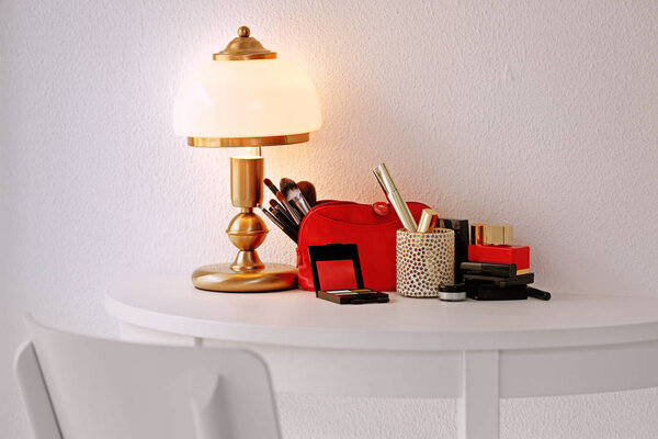 Set of cosmetics and lamp