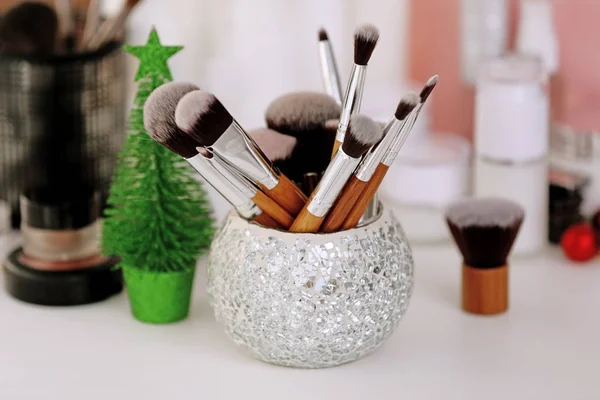 Set of brushes and souvenir fir-tree w — Stock Photo, Image