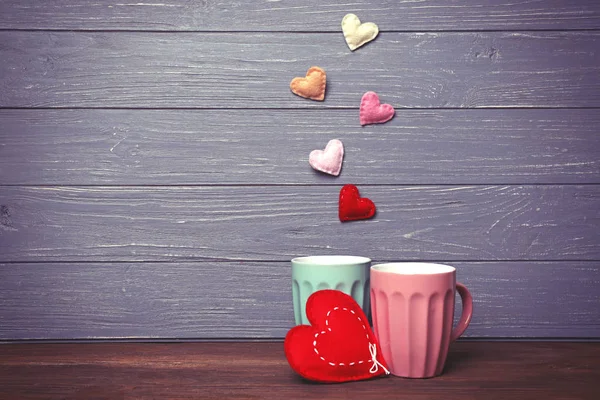 Cups and color hearts — Stock Photo, Image