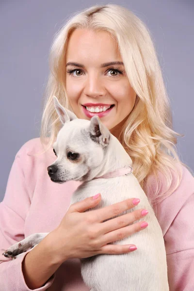 Girl holding cute dog — Stock Photo, Image