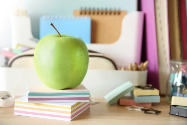 Green apple with stationery — Stock Photo, Image