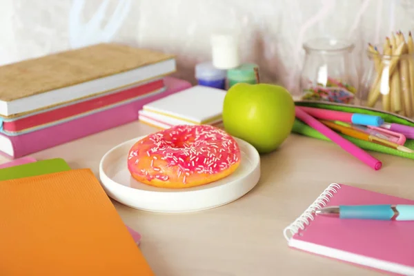 Donut and apple with stationery — Stock Photo, Image