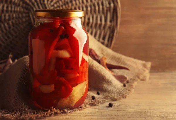 Canned red peppers in jar — Stock Photo, Image