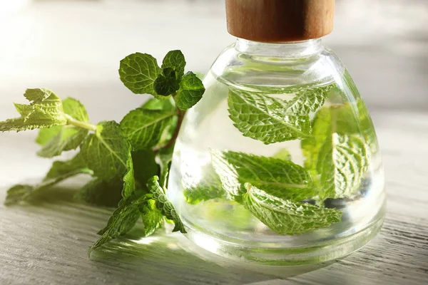 Essential oil with mint — Stock Photo, Image