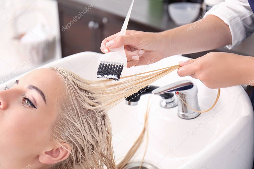 Hairdresser putting mask